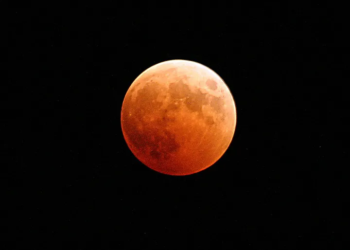 US Navy 041027-N-9500T-001 The moon turns red and orange during a total lunar eclipse